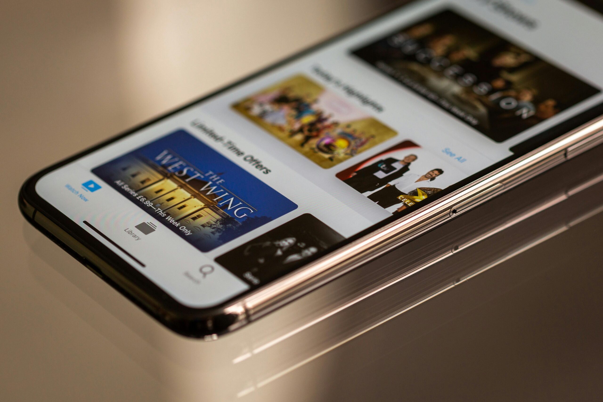 Invisible Apps: The Rise of Hidden Mobile Software That Spies Without Installation Close-up view of a smartphone featuring a streaming service interface, highlighting technology in modern entertainment.